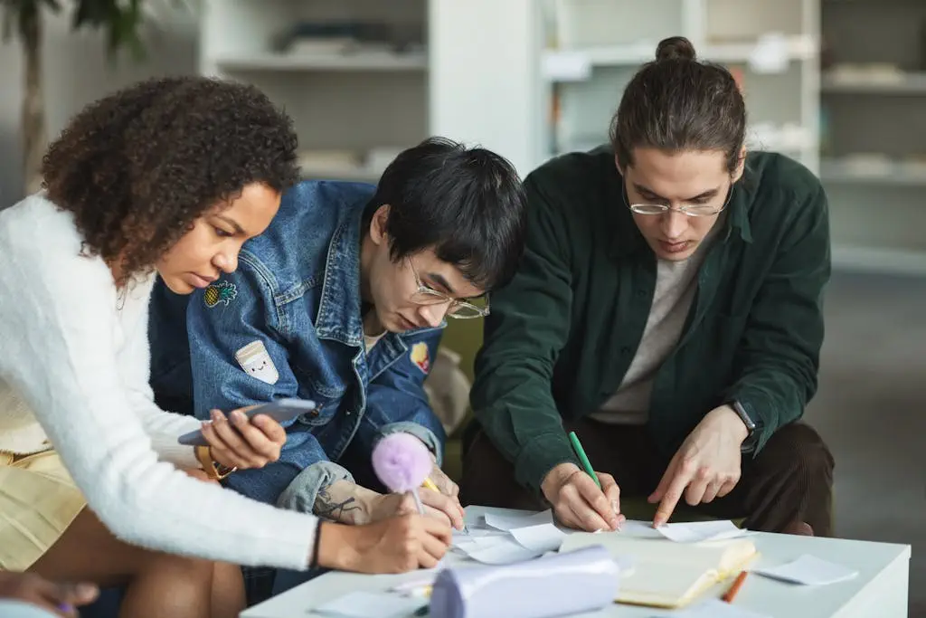 Multiracial group of young adults collaborating on a study project in a modern library.